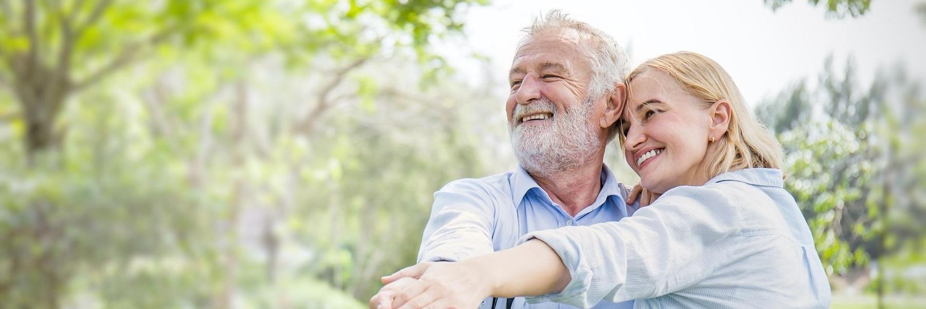 A happy man and a woman with dental crowns in Littleton, CO