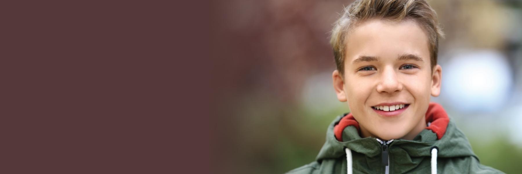 Child smiling after dentist appointment in Highlands Ranch