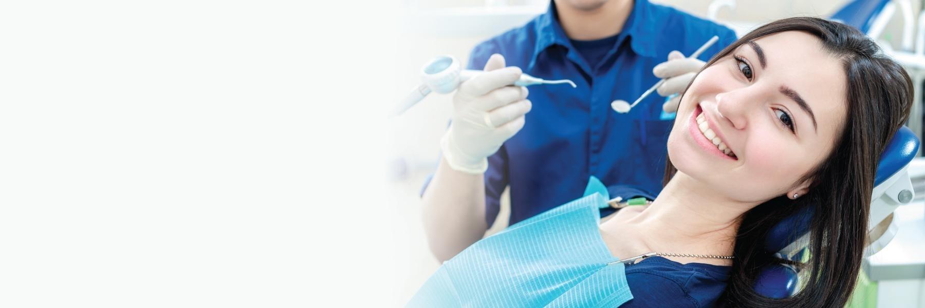 Girl smiling at dentist in Littleton CO